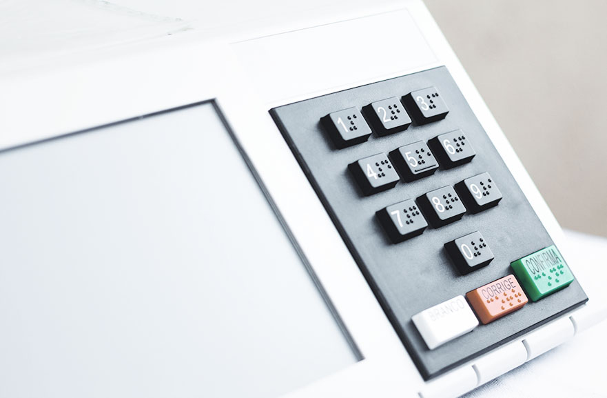 White ballot box with black, white, red and green buttons