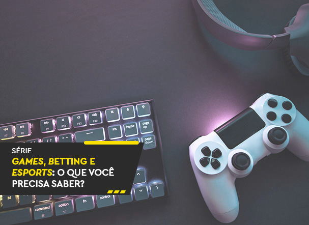 Visão superior de teclado preto com led, ao lado de controle de videogame nas cores branco e preto